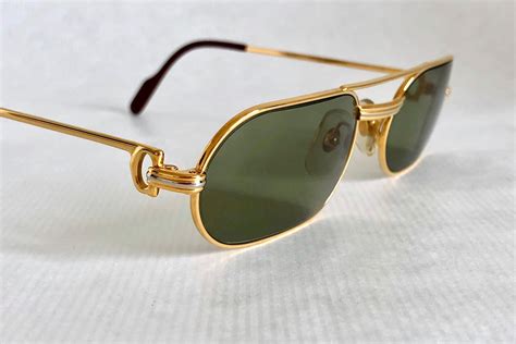 18k solid gold sunglasses.